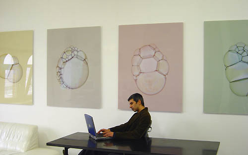 artist in studio with photograms